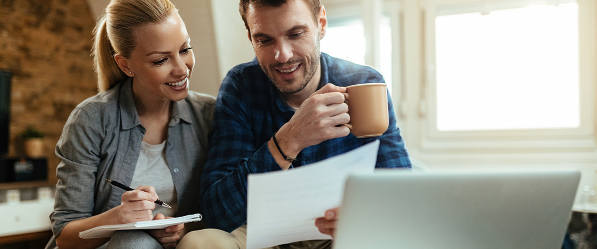 Couple planning their outdoor kitchen budget